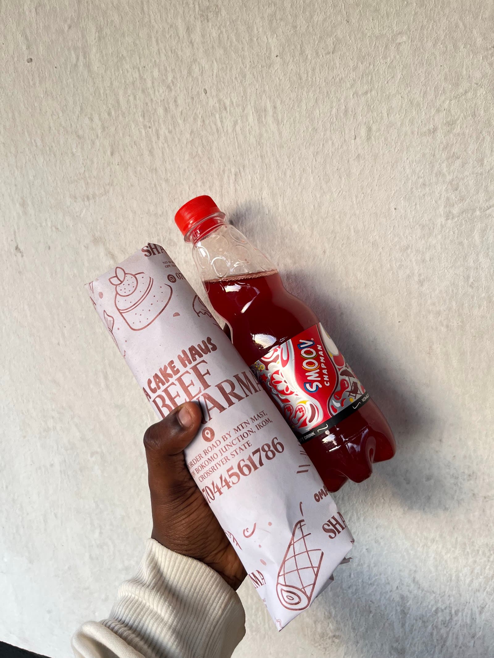 Wrapped beef shawarma with a drink